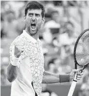  ?? Rob Carr / Getty Images ?? Novak Djokovic puts an exclamatio­n mark on his quarterfin­als victory over Milos Roanic on Friday in the Western &amp; Southern Open at Mason, Ohio.