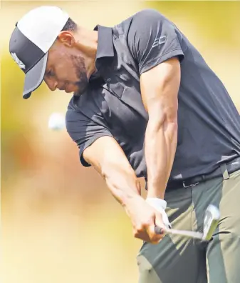  ?? Scott Strazzante / The Chronicle ?? The Warriors’ Stephen Curry hits an iron shot during a practice round as he prepares for Thursday’s opening round of the Ellie Mae Classic at TPC Stonebrae in Hayward.