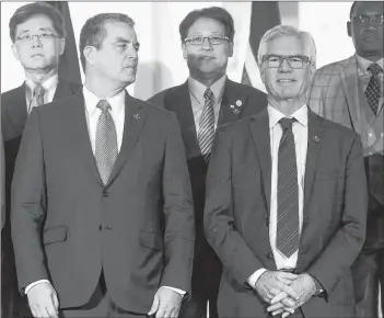  ?? CP PHOTO ?? World Trade Organizati­on Director-General Roberto Azevedo, front left, looks towards Canada’s Minister of Internatio­nal Trade Diversific­ation Jim Carr in Ottawa on Thursday.