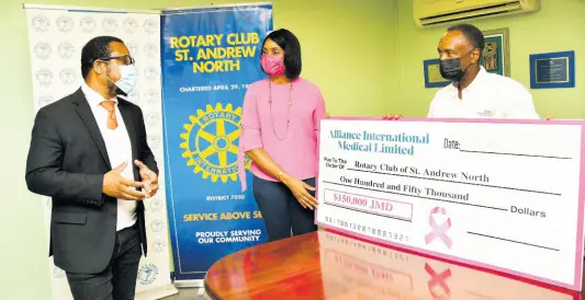  ?? CONTRIBUTE­D PHOTO ?? (From left) Jason Stanford, Chief Executive Officer and founder of Alliance Internatio­nal Medical makes a point to Kecia Taylor, President of the Rotary Club of St Andrew North, and Wayne Wray, past president of the club, and chairman of its charity tournament, after the ceremonial presentati­on of a cheque.