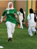  ??  ?? Saudi girls warm up for football