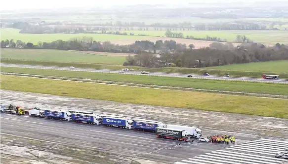  ?? AP ?? Some 150 trucks are parked at Manston Airfield during a test for a ‘no-deal’ Brexit, to assess where some 6,000 trucks could be parked at the derelict airfield near Ramsgate in southeast England on Monday, January 7. The former airfield at Manston could be used as part of the government’s plan to park some 6,000 trucks to alleviate expected congestion at the channel ports, about 25 miles (40km) from the airfield, caused by the reintroduc­tion of customs checks on goods in the event of Britain making a no-deal withdrawal from the European Union at the end of March.