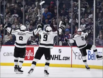  ?? PHOTOS BY FRED GREENSLADE — THE CANADIAN PRESS VIA AP ?? The Kings' Pierre-Luc Dubois, right, celebrates his goal against Winnipeg with Drew Doughty and Adrian Kempe.