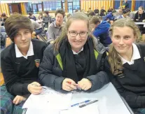  ??  ?? Thinking huddle . . . Geraldine High School pupils (from left) Chyler Farnell, Maddy Smith and Lydia Burnett (all 14) represent their school in the quiz.