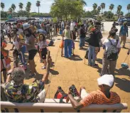  ?? Mark Mulligan / Associated Press ?? People wait to board charter buses that will evacuate them from Galveston Island to Austin.