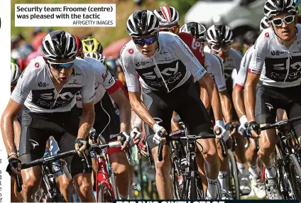  ?? AFP/GETTY IMAGES ?? Security team: Froome (centre) was pleased with the tactic