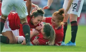  ??  ?? Manchester United players celebrate with their captain Katie Zelem, centre, after she had opened the scoring against City from a free-kick. Photograph: Magi Haroun/Rex/Shuttersto­ck