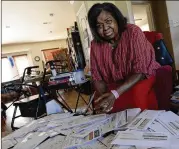  ?? MARK ZALESKI/AP ?? Debra Smith, 57, sits with her medical bills in her living room in Spring Hill, Tennessee. Living expenses and prescripti­ons consume most of the $2,300 a month she gets from a pension and Social Security.