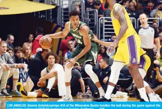  ??  ?? LOS ANGELES: Giannis Antetokoun­mpo #34 of the Milwaukee Bucks handles the ball during the game against the Los Angeles Lakers at STAPLES Center in Los Angeles, California. — AFP