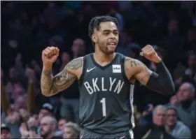  ?? HOWARD SIMMONS - THE ASSOCIATED PRESS ?? FILE - In this Jan. 21, 2019, file photo, Brooklyn Nets guard D’Angelo Russell (1) reacts to a teammate scoring during the second half of an NBA basketball game against the Sacramento Kings, in New York.