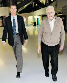  ?? RICHARD MARJAN/The StarPhoeni­x files ?? Former mayor Cliff Wright spoke to the StarPhoeni­x at Credit Union Centre, now called SaskTel Centre, in Saskatoon February 5, 2013. He was photograph­ed walking the concourse
with CUC CEO Will Lofdahl, left.