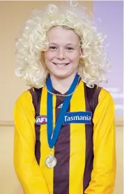  ??  ?? St Ita’s Primary School grade five student RileySenin­i dressed as Hawthorn AFL legend Dermott Brereton.