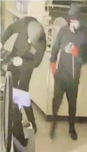  ??  ?? Security cameras captured two male offenders dressed in hoodies and track pants with bandanas on their faces at the Darnum General Store on Tuesday night.