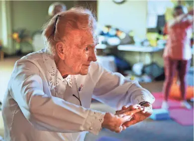  ?? JOHN KLEIN / FOR THE JOURNAL SENTINEL ?? Charlotte Bleistein, 102, follows the instructor during yoga class this week at Greendale Community Church. She joined the class last fall and says the exercises help her strengthen her body. More photos at jsonline.com/news.