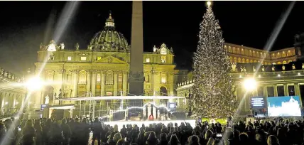  ?? ?? FESTIVE SEASON People gather for the lighting of the Vatican Christmas tree on Dec. 11, 2020, amid the COVID pandemic.