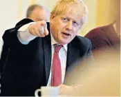  ??  ?? Boris Johnson receives his daily update on the coronaviru­s epidemic in Downing Street