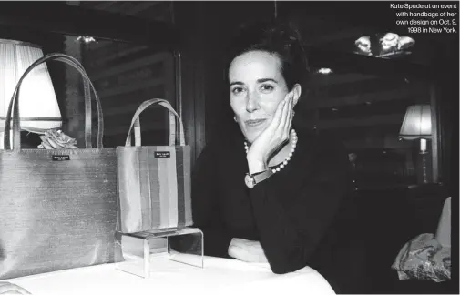  ??  ?? Kate Spade at an event with handbags of her own design on Oct. 9,
1998 in New York.