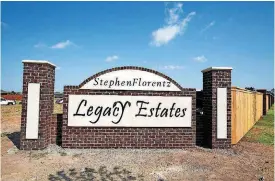  ??  ?? The entrance is shown to the Stephen Florentz Legacy Estates addition, developed by Central Oklahoma Habitat for Humanity, on the west side of Council Road south of Wilshire Boulevard. A memorial service was held Thursday for Florentz, and his name...