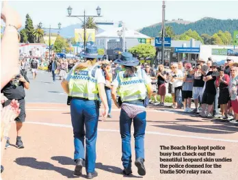  ??  ?? The Beach Hop kept police busy but check out the beautiful leopard skin undies the police donned for the Undie 500 relay race.