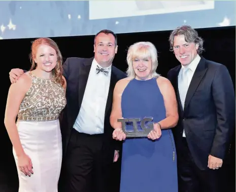  ??  ?? Helen Furlong with her award, with her are TTG editor Pippa Jacks, Neil Davies from award sponsor Bourne Leisure, and celebrity host comedian John Bishop