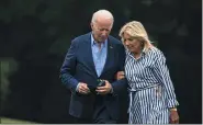  ?? AL DRAGO — BLOOMBERG ?? President Biden and first lady Jill Biden walk on the South Lawn of the White House after arriving on Marine One in August.