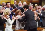  ?? CP PHOTO SEAN KILPATRICK ?? Interim Conservati­ve leader Rona Ambrose and Prime Minister Justin Trudeau embrace during farewell speeches to Ambrose in the House of Commons on Tuesday.