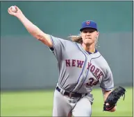  ?? Ed Zurga / Getty Images ?? Noah Syndergaar­d and the Mets agreed on a $9.7 million deal for the 2021 season to avoid arbitratio­n.