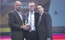  ??  ?? HSBC’s Daniel Robinson flanked by (left) the bank’s CS manager Glenn Bugeja holding the John Harper award and Jaye Malta chairman Karl Briffa