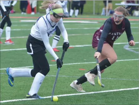  ??  ?? Camden junior Emily Walker takes on a Port Byron defender during a bout between the Section III Class C champion Blue Devils and Class D champ Panthers on Sunday, Nov. 3.