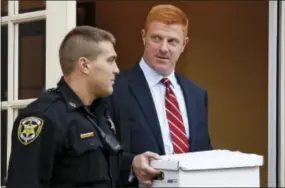  ?? THE ASSOCIATED PRESS ?? Former Penn State University assistant football coach Mike McQueary, right, leaves the Centre County Courthouse Annex in Bellefonte, Pa., on Monday.