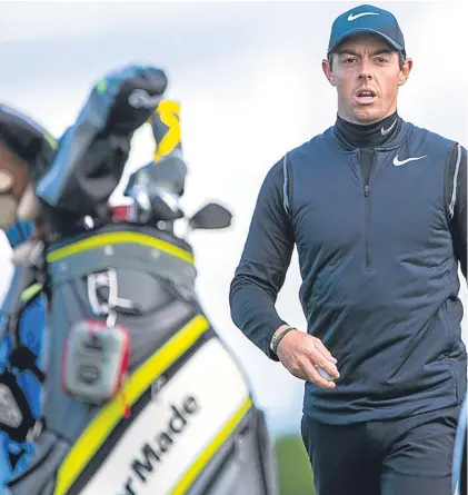  ?? Picture: SNS Group. ?? World No 4 Rory McIlroy makes his way to the ninth green during yesterday’s practice round at Dundonald Links in Ayrshire.
