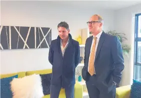  ?? Photo / Emma Russell ?? Phil Twyford, with John Penny from Penny Homes at the unveiling, says 12 more homes will join the first 18 in Papakura by Christmas.