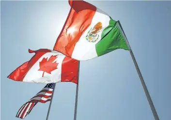  ?? THE ASSOCIATED PRESS FILES ?? National flags representi­ng the U.S., Canada, and Mexico are seen in New Orleans in this file photo.