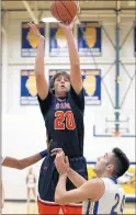 ?? ALLEN CUNNINGHAM / DAIL YSO UTHTOWN ?? Stagg’s Tom Kazanecki (20) grabs a rebound and puts up a shot in the first half as Sandburg’s Edmond Milo (24) defends during a game in 2016.