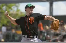  ?? ROSS D. FRANKLIN — THE ASSOCIATED PRESS ?? San Francisco Giants starting pitcher Ross Stripling throws against the Oakland Athletics during the first inning on March 17in Mesa, Ariz.