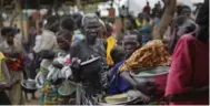  ?? BEN CURTIS/THE ASSOCIATED PRESS FILE PHOTO ?? Refugees from South Sudan have flooded into northern Uganda fleeing war. Some hungry Ugandans are joining them.