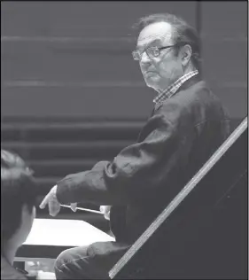  ?? CP PHOTO ?? Charles Dutoit performs with the Philadelph­ia Orchestra during a rehearsal.