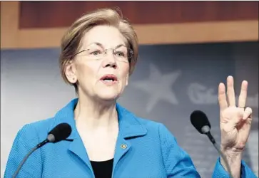  ?? J. Scott Applewhite Associated Press ?? SEN. Elizabeth Warren (D-Mass.), a key member of the banking panel, is opposed to a bill that would revise Dodd-Frank to help small and midsize banks. Four moderates are among the Democrats in favor of it.