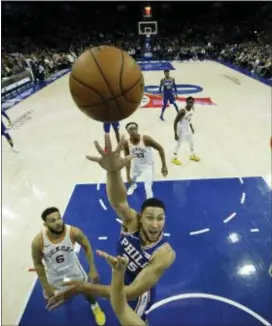  ?? THE ASSOCIATED PRESS ?? 76ers’ Ben Simmons (25) goes up for a shot past Indiana Pacers’ Cory Joseph (6) during the first half of Tuesday night’s game.
