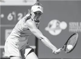  ?? MARK J. TERRILL AP ?? Elena Rybakina, of Kazakhstan, returns to Karolina Muchova, of the Czech Republic, in her victory at the BNP Paribas Open tournament in Indian Wells.