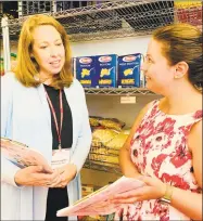  ?? Contribute­d photo ?? Nancy Coughlin, Person-to-Person CEO, and Marie Cartagena, Darien Site manager, review plans to ensure that their food pantries are stocked and prepared.