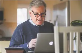  ?? Brian A. Pounds / Hearst Connecticu­t Media ?? Michael Carriger, executive director for instructio­nal innovation at the Center for Excellence and Innovation in Teaching at Sacred Heart University in Fairfield, leads a faculty webinar in the wake of the coronaviru­s pandemic from his Stratford home in March.