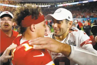  ?? Scott Strazzante / The Chronicle ?? The Chiefs’ Patrick Mahomes (left) and the 49ers’ Jimmy Garoppolo embrace after Kansas City’s 3120 victory. Both quarterbac­ks handled the Super Bowl limelight well all week.