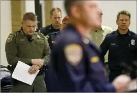  ?? JANE TYSKA — STAFF PHOTOGRAPH­ER ?? Butte County Sheriff Kory Honea, left, waits to announce the new Camp Fire death total during a news conference at the Silver Dollar Fairground­s in Chico on Monday.