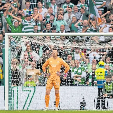  ?? ?? It’s the loneliness of the Rangers keeper as Jon McLaughlin reflects on his gaffe at Celtic’s fourth goal