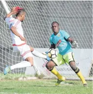  ?? RICARDO MAKYN/MULTI MEDIA PHOTO EDITOR ?? Portmore United’s Jermie Lynch (left) scores the opener while Humble Lion’s goalkeeper, Devon Haughton, looks on helplessly in their Red Stripe Premier League encounter at the Spanish Town Prison Oval yesterday.