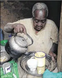  ?? CONTRIBUTE­D ?? Keifah relied on passersby to bring her water from a nearby well. She carefully rationed her water use so two jugs would last a week.