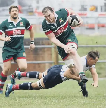  ??  ?? George Roberts makes a tackle for Peterborou­gh Lions at Broadstree­t. Photo: Mick Sutterby.