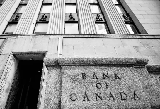  ?? REUTERS ?? The Bank of Canada is expected to leave its benchmark interest rate, the target for the overnight rate, on hold today after raising it to a 22-year high of five per cent to cool inflation, but it’s then expected to begin a rate-cutting campaign in April or June.