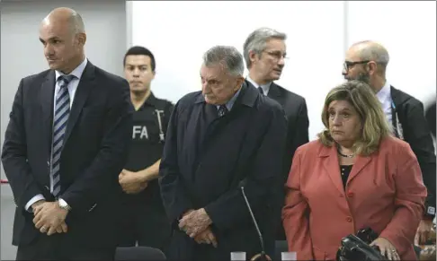  ??  ?? Ford’s former executive Hector Sibilla (centre) is pictured before being sentenced for collaborat­ing in the military dictatorsh­ip’s “dirty war” against leftist dissent, in court in San Martin, Buenos Aires, yesterday.